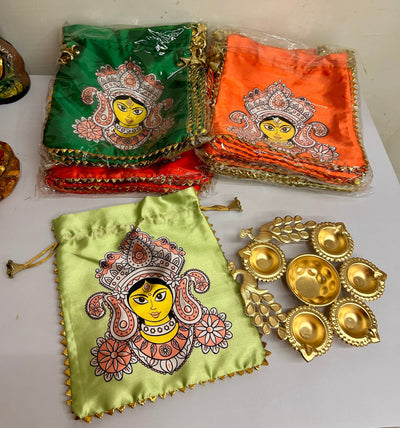 130 rs combo on buying 25+ combo's / WhatsApp at 8619550223 to order 🔥 diwali hampers 1 combo Combo of Mataji Potli Bag and Peacock metal Urli for Navratri and Diwali return gifts 🎁  (video attached)