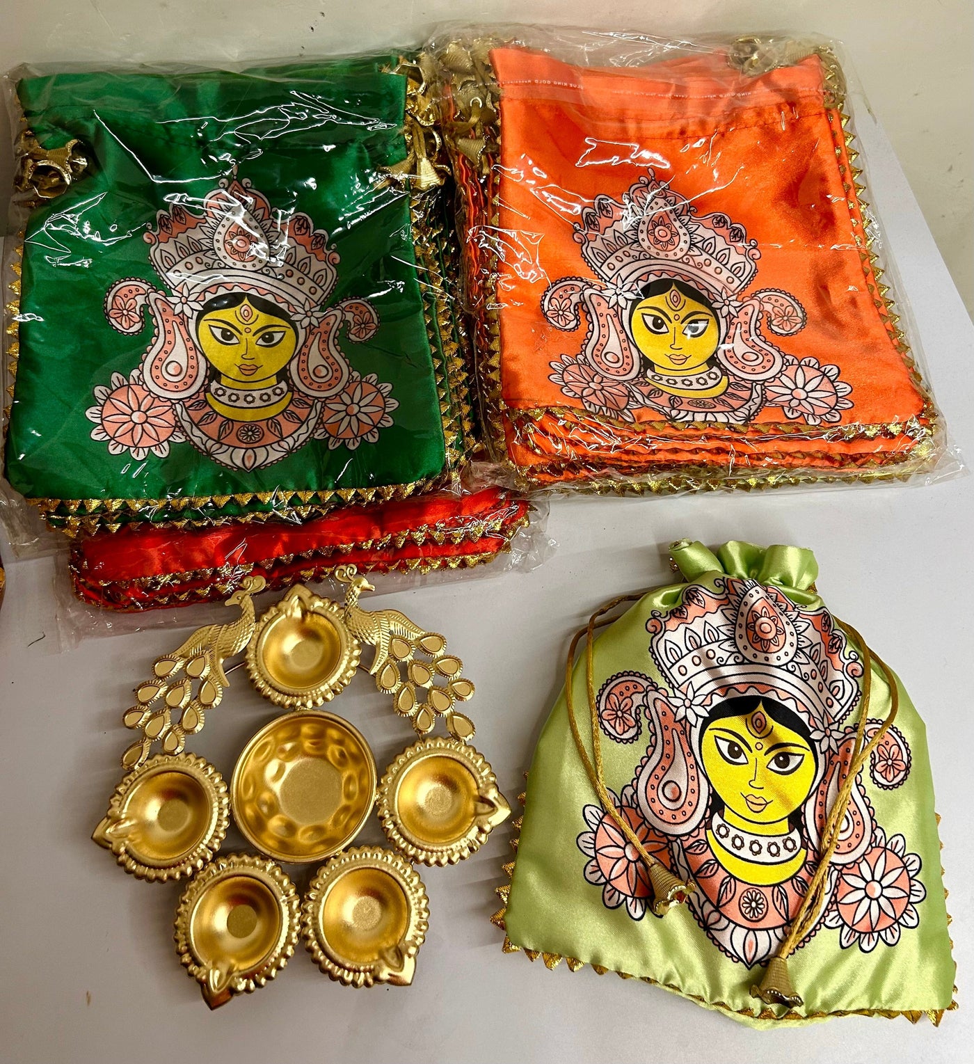 130 rs combo on buying 25+ combo's / WhatsApp at 8619550223 to order 🔥 diwali hampers 1 combo Combo of Mataji Potli Bag and Peacock metal Urli for Navratri and Diwali return gifts 🎁  (video attached)