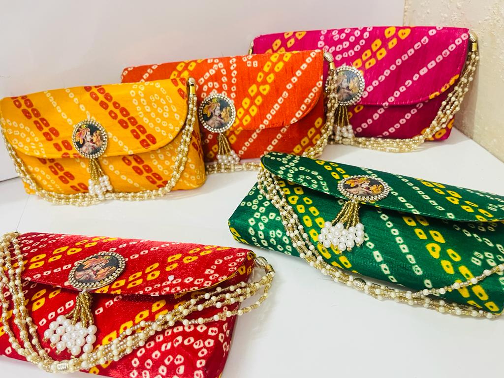 135 Rs each on buying 🏷in bulk | Call 📞 at 8619550223 Clutch LAMANSH® Bandhej Clutches with Radha Krishan Brooch | Wedding envelopes for Wedding Favors Gifting 🎁 & giveaways