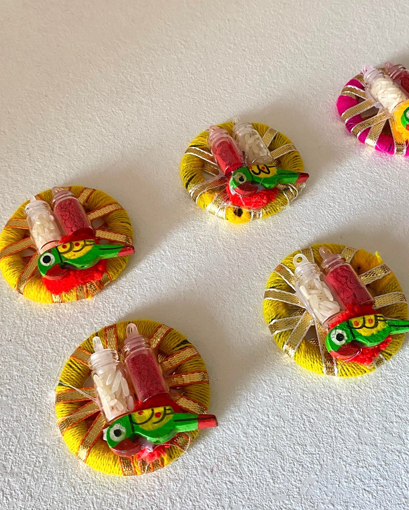 25 rs each on buying 100+ pcs | WhatsApp at 8619550223 haldi kumkum 1 Roli chawal in glass bottles with peacock design / platters on gota rings for festival, pooja or wedding favours 🎁