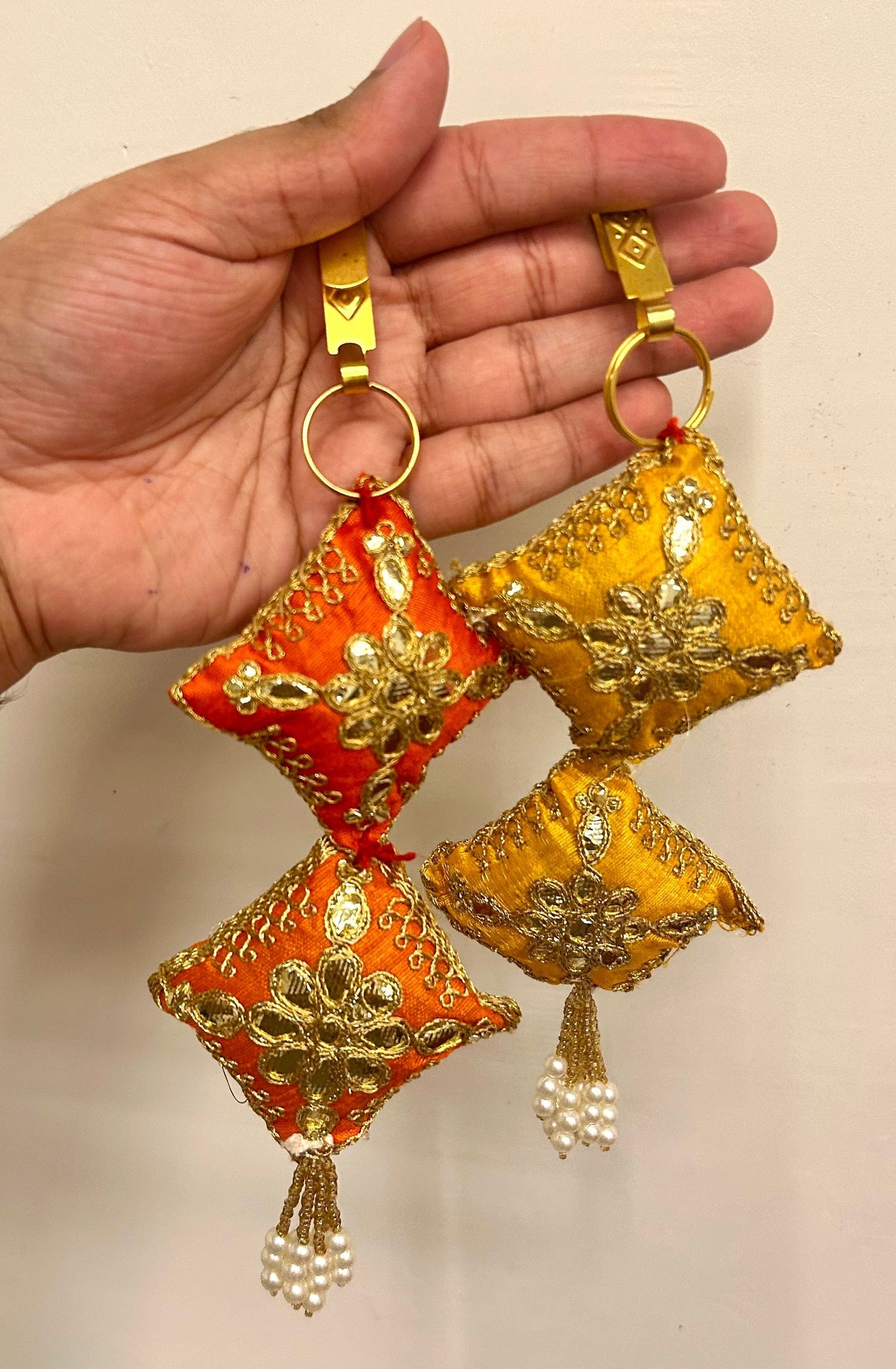 55 Rs each on buying 50+ pcs / WhatsApp at 8619550223 to order satka pins Designer fabric embroidered satka's keychains for ladies | haldi mehendi sangeet favors for bridesmaids in weddings