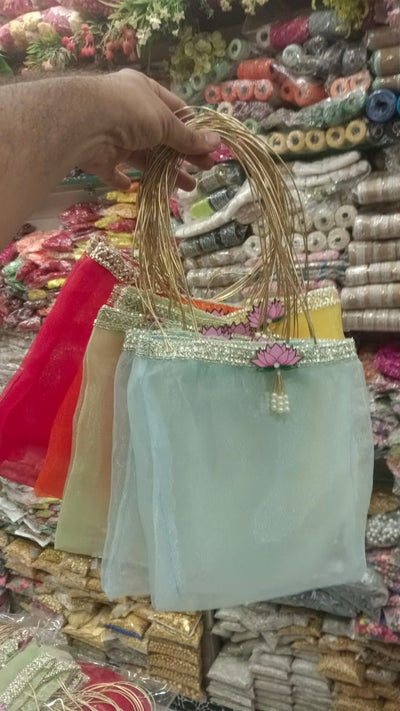 75 rs each on buying 25+ pcs / WhatsApp at 8619550223 to order 🔥 gift bags Multicolor Lotus Organza gifts bags for return gifts 🎁 and favours in weddings, pooja or festivals like Diwali and Navratri (8*10 inch size)