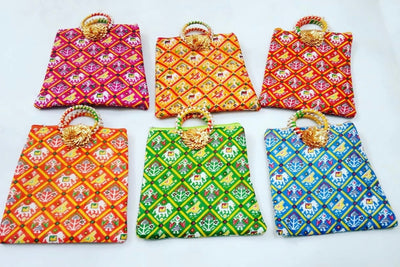 90 Rs each on Purchasing in bulk (50+ qty)📱at 8619550223 gift hand bag LAMANSH Patola print hand bags for haldi mehendi sangeet wedding return gifts 🎁 / Pooja or festival ceremony favours