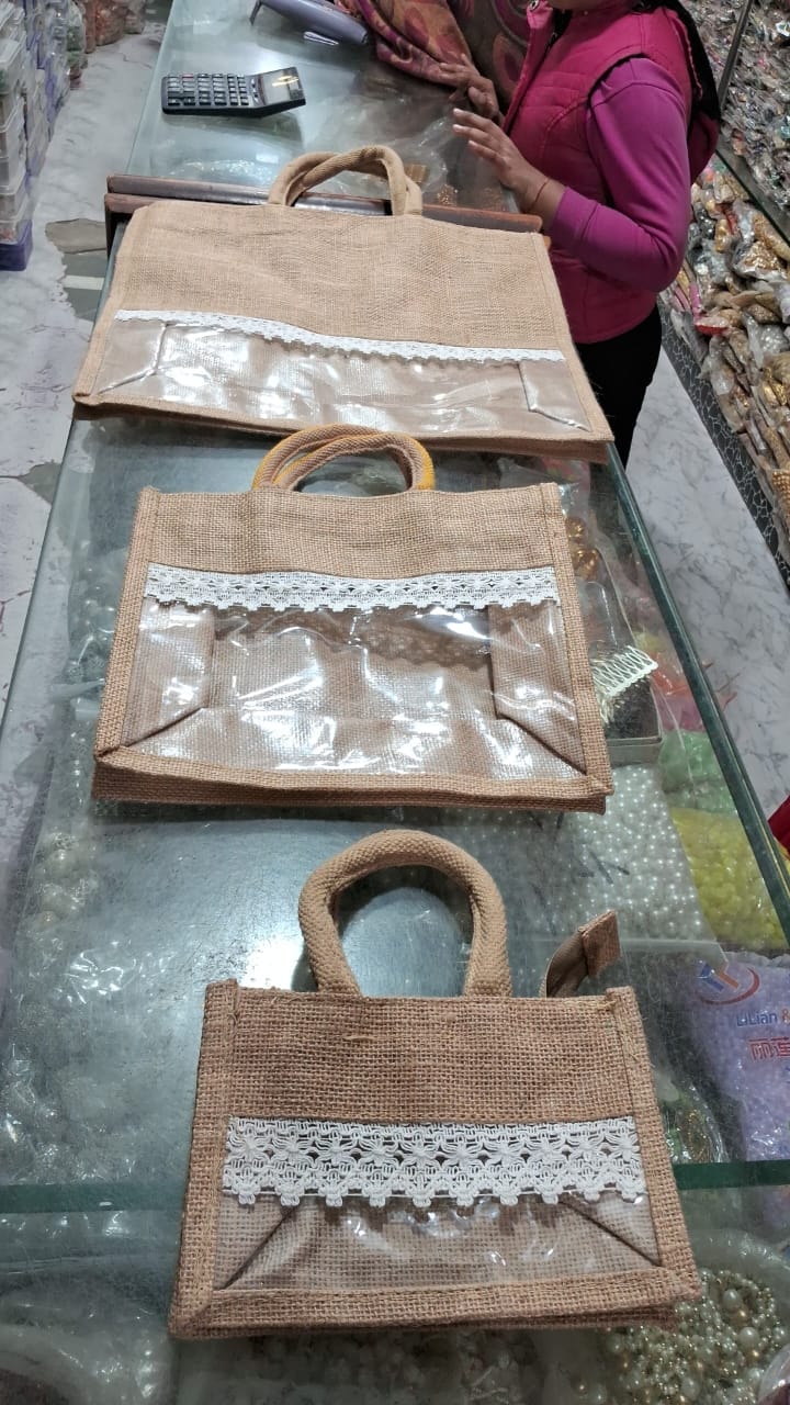 AVAILABLE IN 3 SIZeS / CHECK THE PRODUCT DESCRIPTION TO CHECK THE WHOLESALE PRICE jute gift bags Transparent Fancy Jute bags in Natural brown clor for Room Hamper Basket and Gift packaging (Available in 3 sizes)