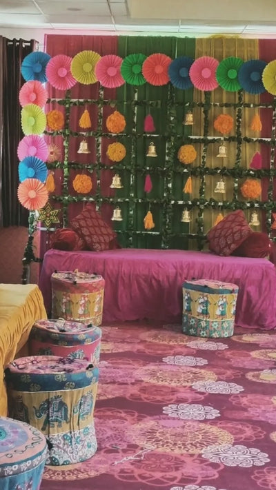 Rajasthani Themed Backdrop ( Rajasthani Mudda's , Paper Fans & Woolen Tassels )