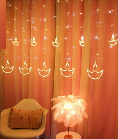 LAMANSH Rice light Yellow / Plastic / 6 feet LAMANSH® Diya Diwali Light Curtain, String Lights with 12 Hanging Diyas, 8 Flashing Modes - 2.5 Meter (1 Curtain) 138 LED , (6+6 Diyas )